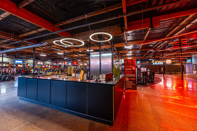 F19 Renton reception and fitness floor with overhead ring lighting