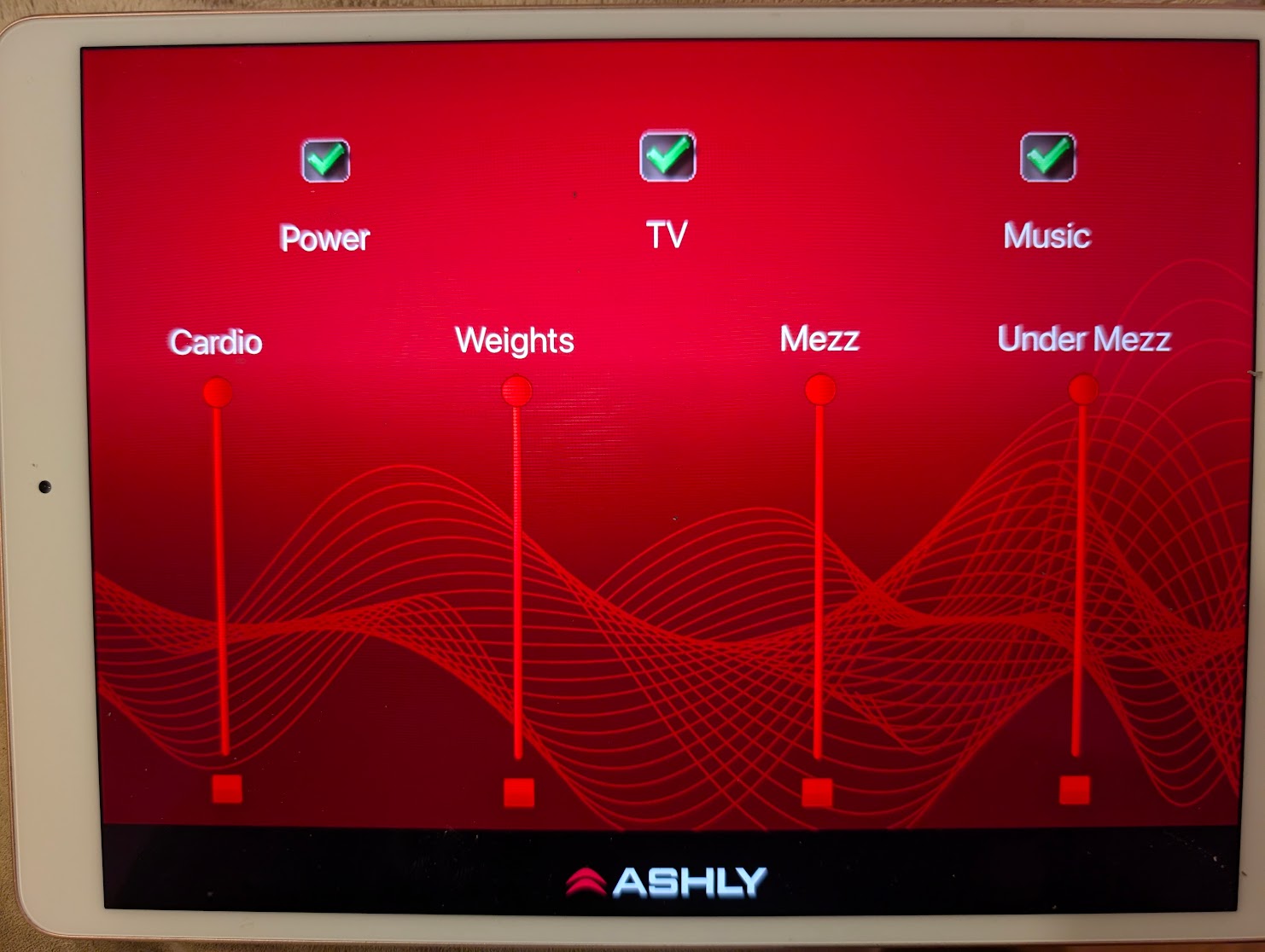 iPad audio control interface with Power, TV and Music controls and four zone volume sliders